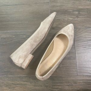 Nude suede flats.